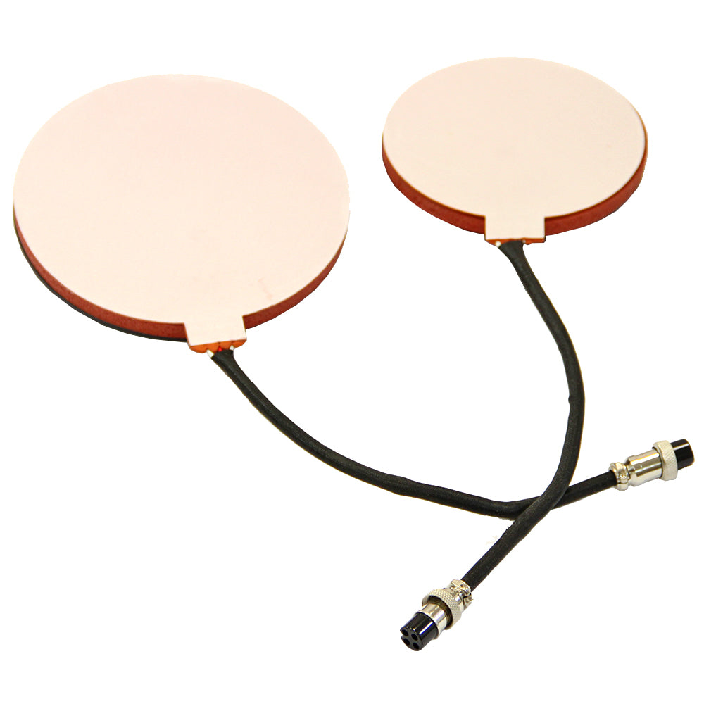 Zwei runde, kupferfarbene Heizplatten mit flexiblen Kabeln, ideal für den Einsatz in einem 5-in-1-Gerät zur Vinylbearbeitung und Druckanwendungen