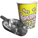 Edelstahl-Popcorn-Schaufel mit glänzender Oberfläche, neben einem gelben Popcornbecher mit buntem Aufdruck und klassischem Popcorn-Motiv