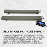 Zwei graue Wiegebalken für bis zu 3000 kg, ausgestattet mit einem digitalen Display für einfache Ablesbarkeit und Wandmontageoption