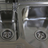 Hochwertige Edelstahl Küchenspüle mit zwei Becken, glänzender Oberfläche, runden Abflüssen und modernem Design, ideal für jede Küche