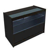 Schwarze LED-Ladentheke C1200 mit gläserner Oberseite, beleuchtetem Innenraum und modernem, minimalistischen Design, ideal für Verkaufsräume