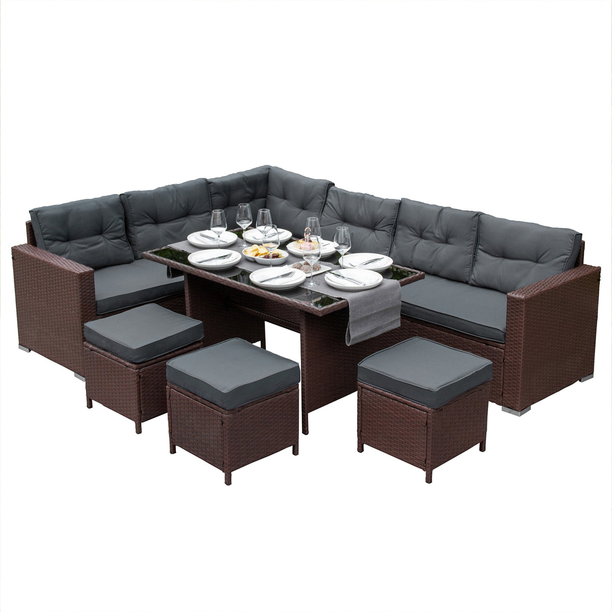 Schwarzes Polyrattan Gartenmöbel Set mit bequemen grauen Kissen, einem Glastisch und zusätzlichen Hockern für stilvolles Outdoor-Dining