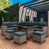 Rattan-Eckset in Grau mit bequemen, gepolsterten Sitzkissen, stilvolles Design, ideal für Terrassen und Gärten, auf Holzdeck platziert