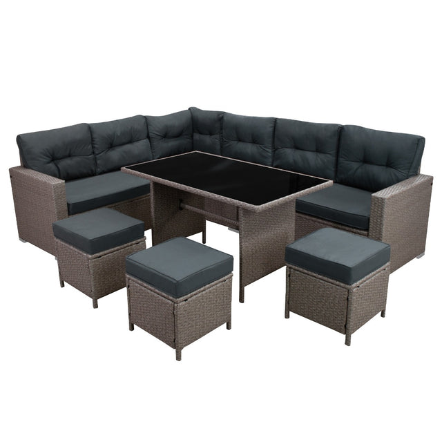 Elegantes Polyrattan Gartenmöbel Set in Grau mit bequemen, dunkelgrauen Polstern, bestehend aus einer L-förmigen Couch und einem Tisch mit Glasplatte