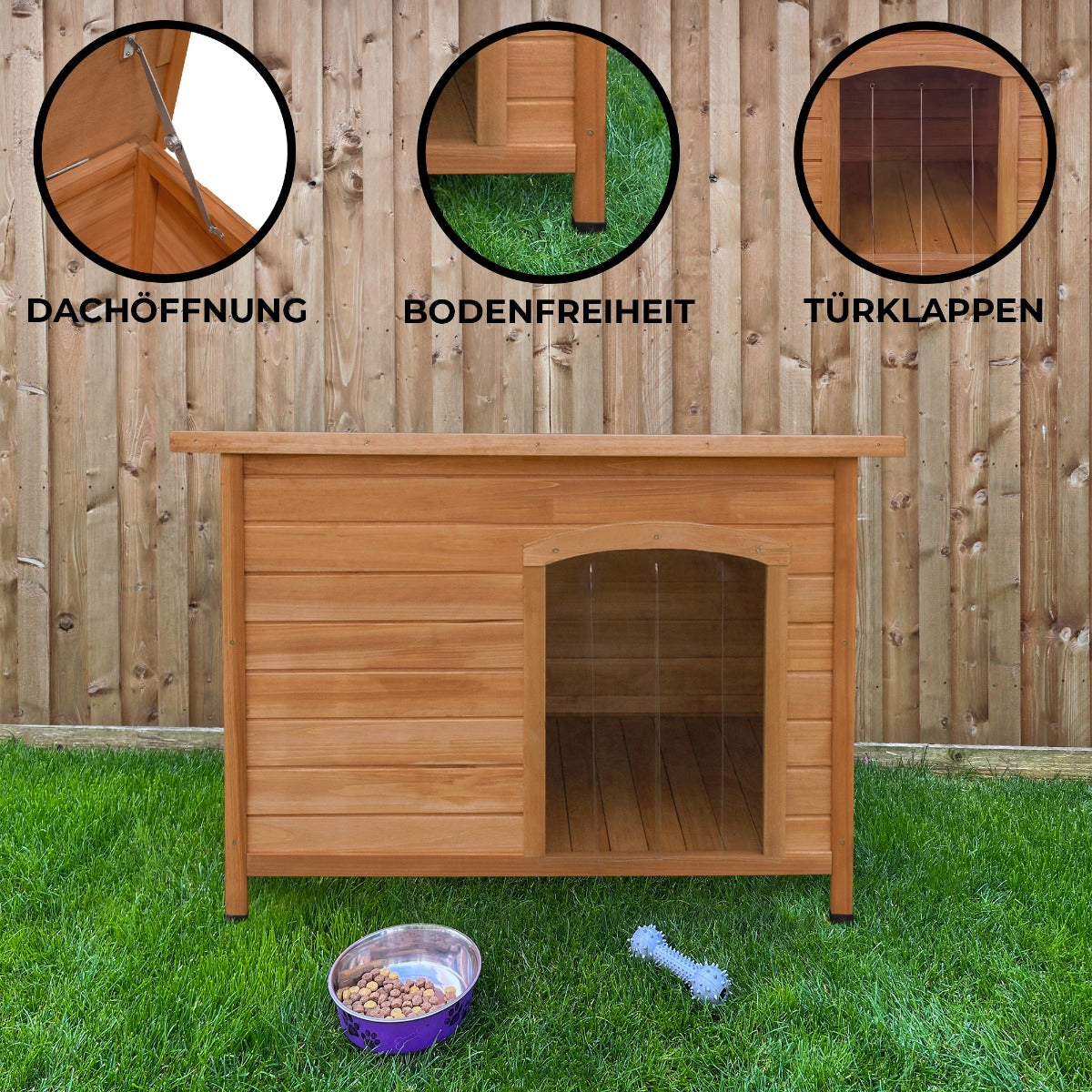 Mittelgroße Hundehütte aus hellem Holz mit Dachöffnung, erhöhtem Boden und Türklappen, umgeben von grünem Gras und einem Holzzaun