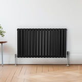 Ovaler Röhrenheizkörper in Schwarz, 600mm x 1020mm, mit vertikalen Röhren und glänzender Oberfläche, ideal für moderne Innenräume und effiziente Wärmeabgabe