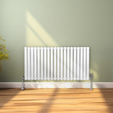 Ovaler Röhrenheizkörper in Weiß, 600mm x 1200mm, mit glatten, vertikalen Röhren und stabilen Füßen, ideal für moderne Wohnräume