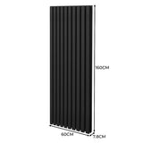 Ovaler Röhrenheizkörper in Schwarz, 1600mm x 600mm, mit vertikalen Lamellen und glatter Oberfläche, ideal für moderne Innenräume