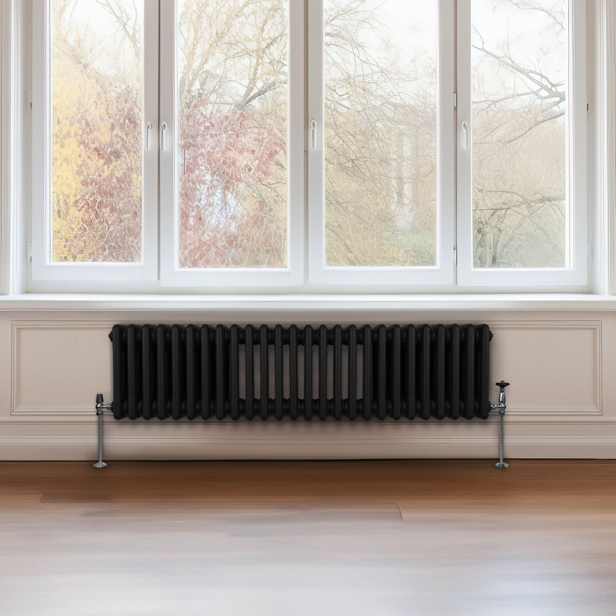 Traditioneller 3-Spalten-Heizkörper in elegantem Schwarz, 300 x 1192 mm, mit glatter Oberfläche und stabilen Füßen, ideal für moderne Wohnräume