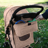 Haustierwagen in gewebtem Beige mit Regenabdeckung, praktischer Fronttasche und ergonomischem Griff, ideal für Spaziergänge im Freien