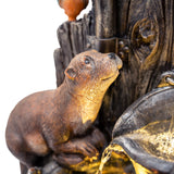 Detailreiche elektrische Wasseranlage "Otter Oasis" mit realistisch gestalteter Otterfigur, die an einem rustikalen Holzstamm sitzt und Wasser sprudelt