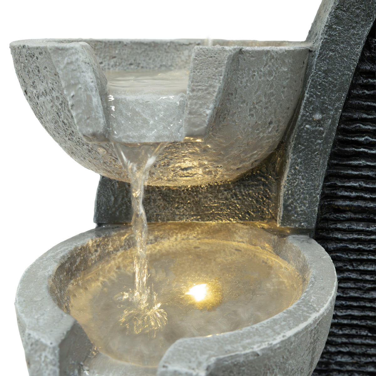 Elegante elektrische Wasseranlage "Sleek Streams" mit zwei Schalen aus grauem Stein, sanft fließendem Wasser und warmem Licht, das die Oberfläche beleuchtet