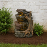 Natürliche Wasseranlage "Willow Springs" aus Stein mit Wasserfall, Holzstruktur und grünem Laub, ideal für Garten- oder Terrassengestaltung