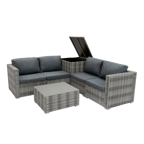 Sechsteiliges Rattan-Möbelset in Grau mit bequemen, dunkelgrauen Kissen, modularer Form und einem praktischen Stauraum im Tisch