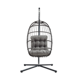 Schwarzer Rattan Hängesessel in Eiform mit grauem, gepolstertem Kissen, stabiler Metallbasis und modernem Design, ideal für Innen- und Außenbereiche