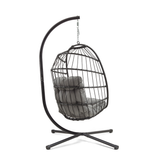 Schwarzer Rattan Hängesessel in Eiform mit grauem Polster, elegant und modern, ideal für Innen- und Außenbereiche, schwebend aufgehängt