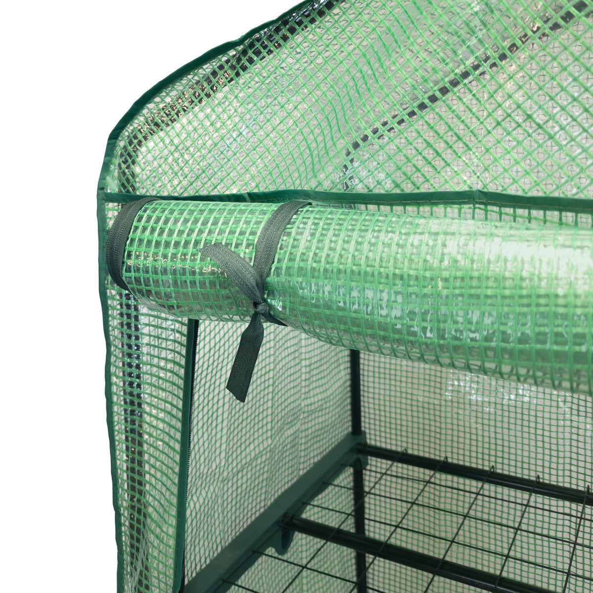 Mini-Gewächshaus mit grüner Polyethylen-Abdeckung, stabilen Metallregalen und Netzstruktur, ideal für Pflanzenzucht und Gartenprojekte