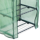 Mini-Gewächshaus mit vier stabilen Regalen, umhüllt von einer transparenten, grünen Polyethylen-Abdeckung, ideal für Pflanzenzucht und Schutz
