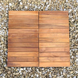 Klickfliesen aus Akazienholz in warmen Brauntönen, mit glatter Oberfläche und gleichmäßigen Holzlatten, auf einem Kiesbett platziert