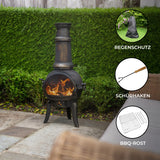Gusseisen Terrassenofen mit rustikalem Design, schwarzer Oberfläche, flammendem Feuer und stabilen Füßen, ideal für gemütliche Abende im Freien