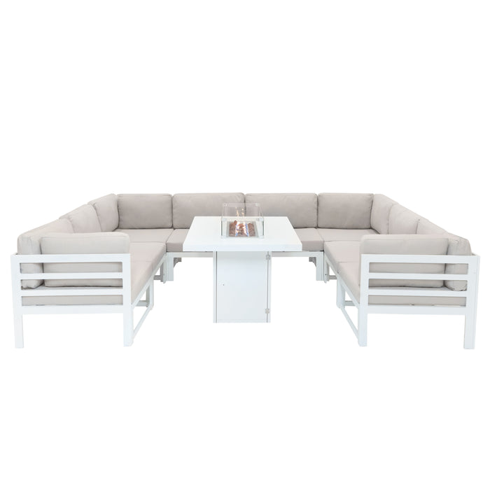 Moderne L-förmige Gartenlounge aus weißem Aluminium mit beigen Polstern und einem zentralen Tisch mit Feuerstelle, ideal für entspannte Abende im Freien