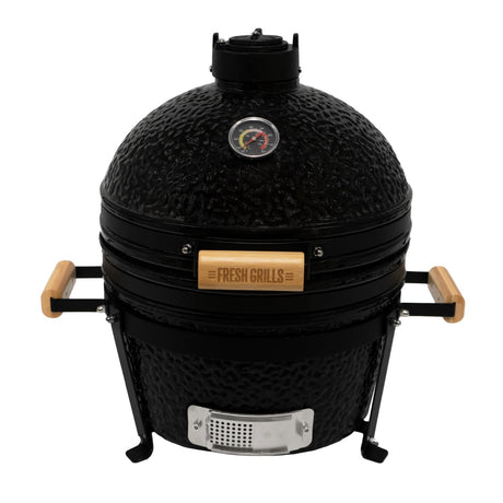 Schwarzer Kamado-Ofen aus Keramik mit Holzgriffen, runder Form, Temperaturanzeige und robustem Grillrost, ideal für Holzkohlegrillliebhaber