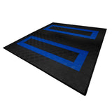 Belüftete Garagenbodenfliesen in Schwarz mit blauen Kanten, rutschfester Textur und rechteckiger Form, ideal für Garagen und Werkstätten