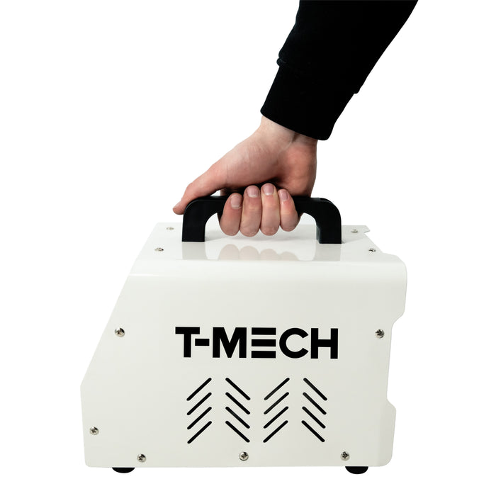 Tragbare T-MECH Maschine in Weiß mit schwarzem Griff, rechteckiger Form und Lüftungsschlitzen, ideal für verschiedene Anwendungen