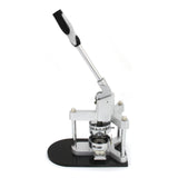 Hochwertige PixMax 25mm Buttonmaschine mit silbernem Metallrahmen, schwarzem Kunststoffsockel und ergonomischem Griff für einfaches Bedienen